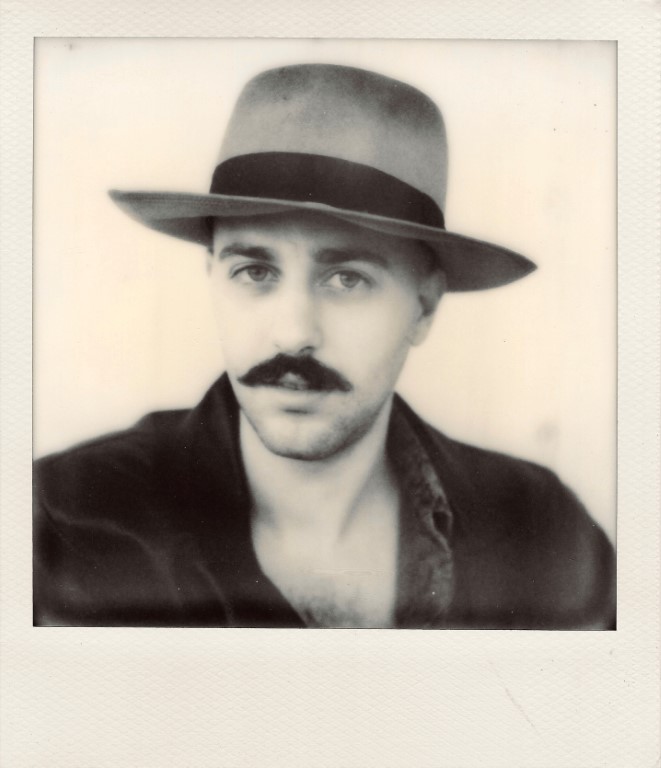 Polaroid of Francesco Calistri with a hat